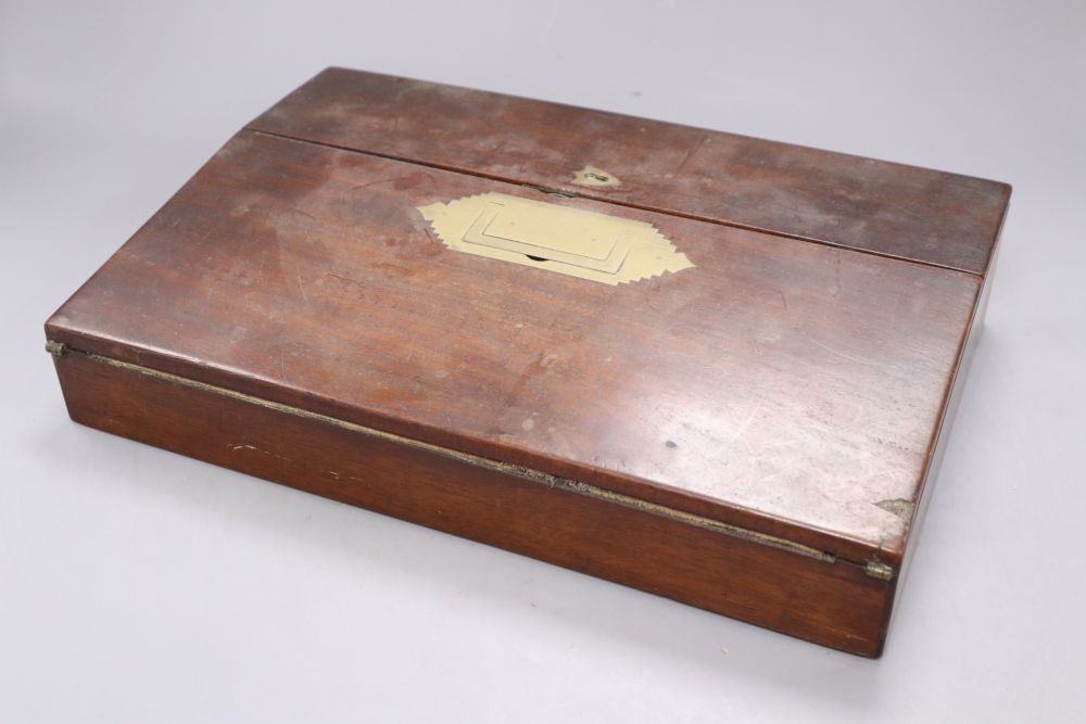 A Georgian mahogany tea caddy with associated mixing bowl and a similar writing slope, longest 35.5cm